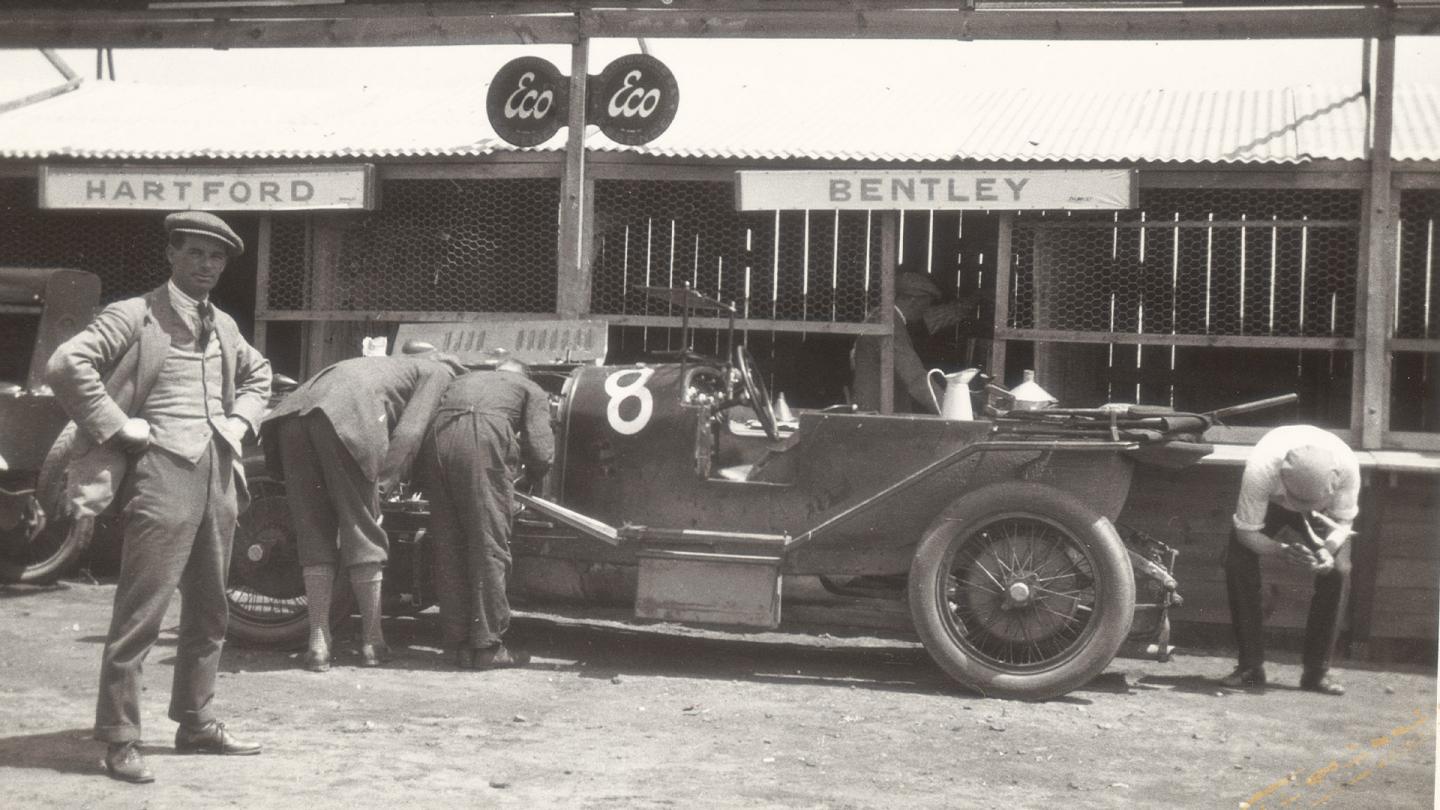 The Bentley works team inspecting a Bentley 3 Litre in the Le Mans pits
