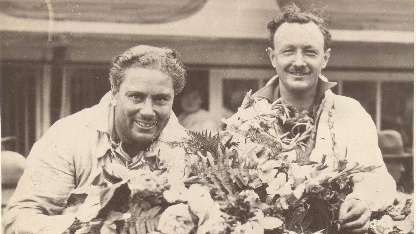 Barnato and Birkin sat on their race winning Bentley enjoying the laurels of their victory