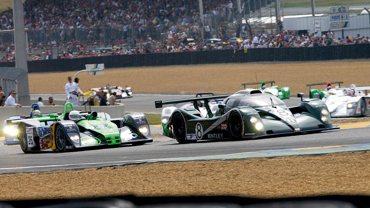 The Bentley EXP Speed 8 car number 8 cutting through traffic during the opening laps of the 24 hours of Le Mans