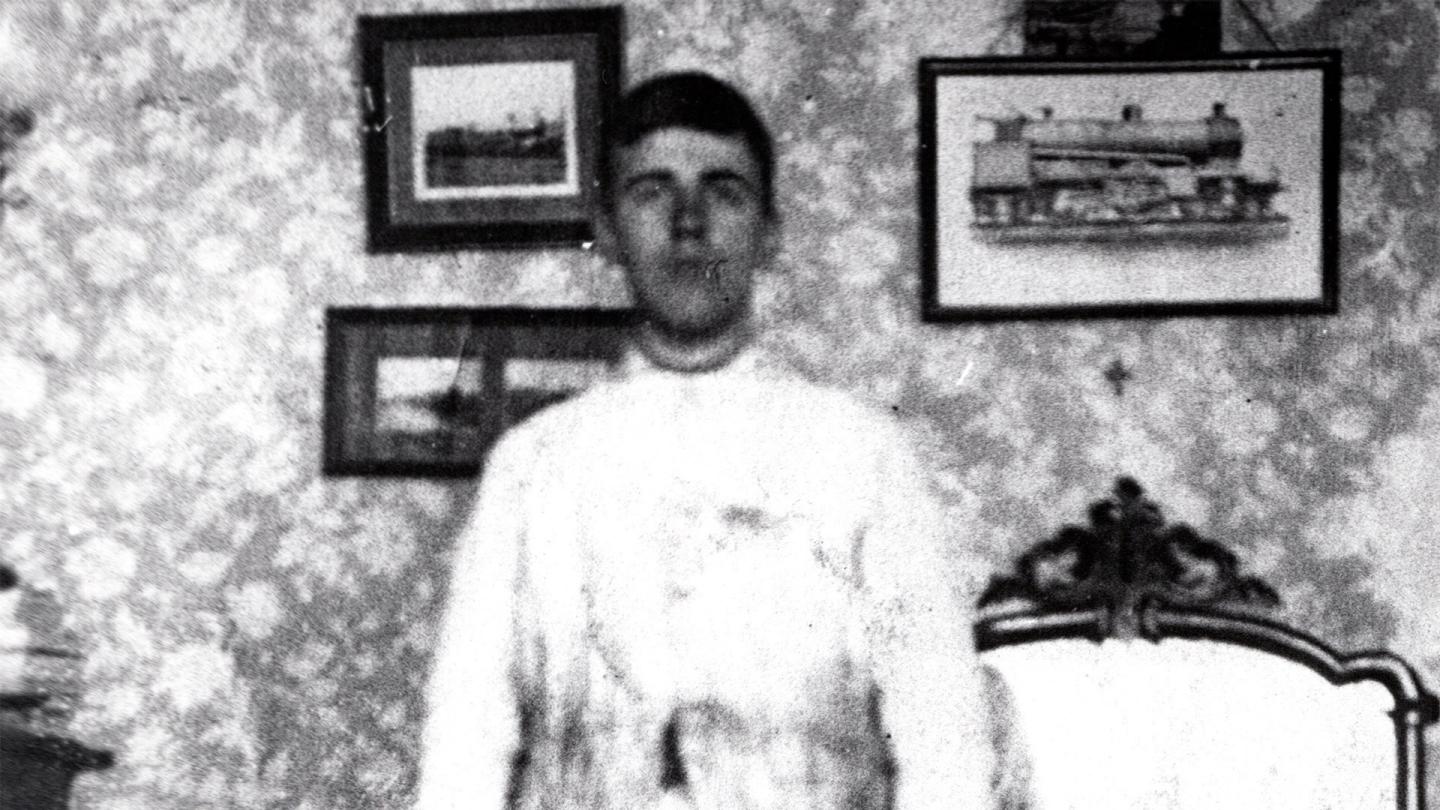 Walter Owen Bentley in his white overalls preparing for his apprenticeship working on steam locomotives