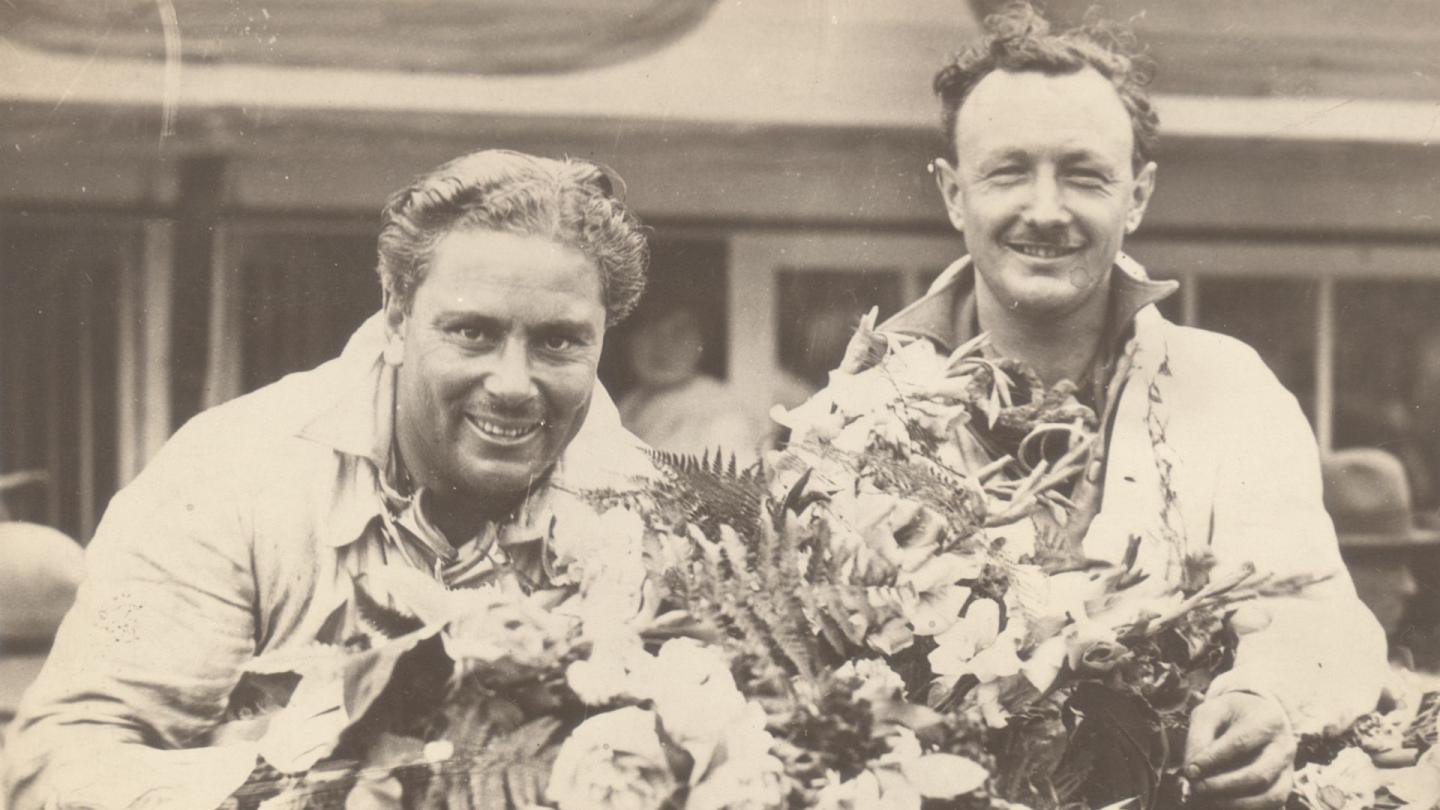 Tim Birkin sat alongside Woolf Barnato on their race winning Bentley celebrating their success at Le Mans