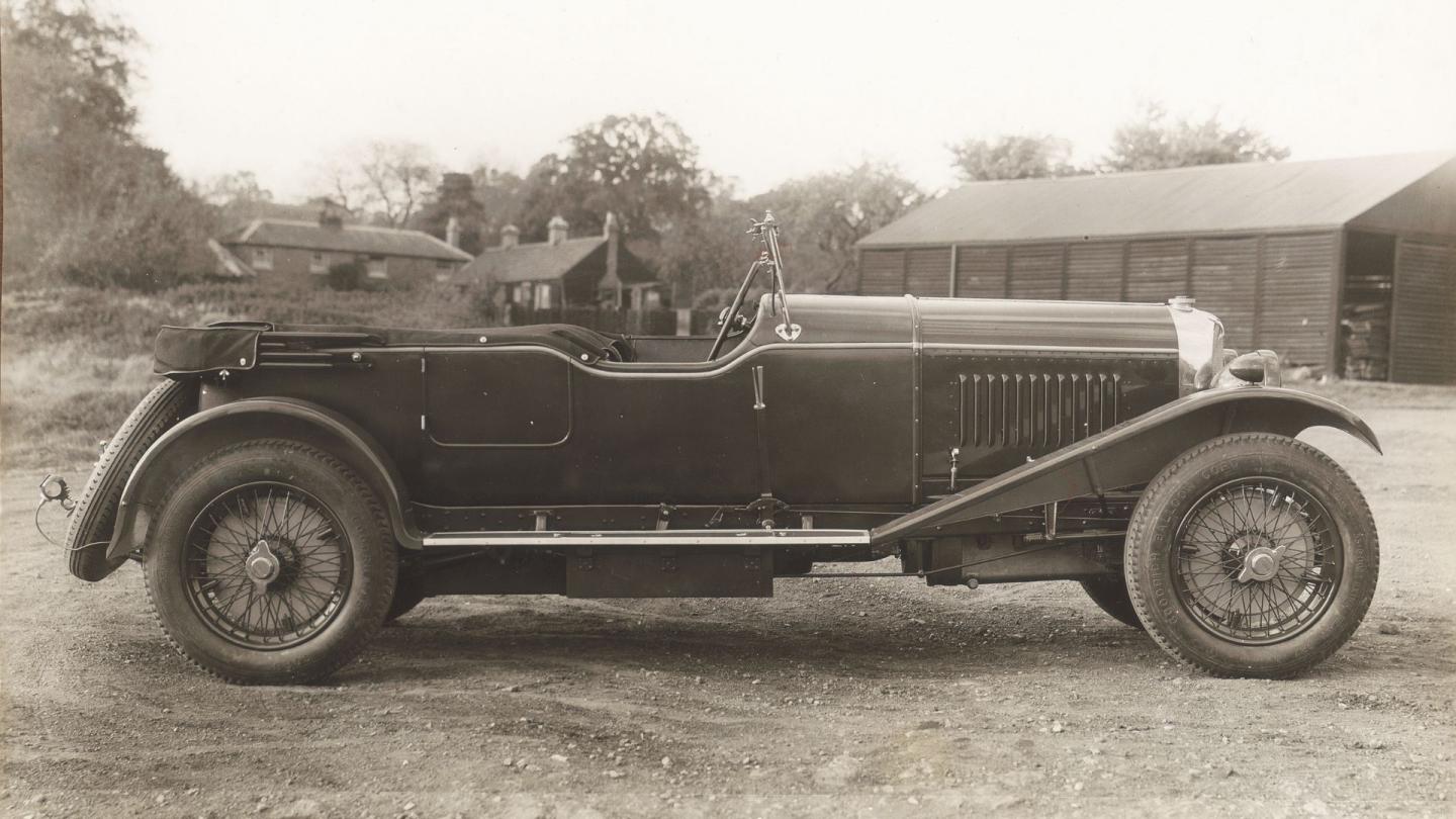 Side profile of a Bentley 4½ Litre in a rural environment