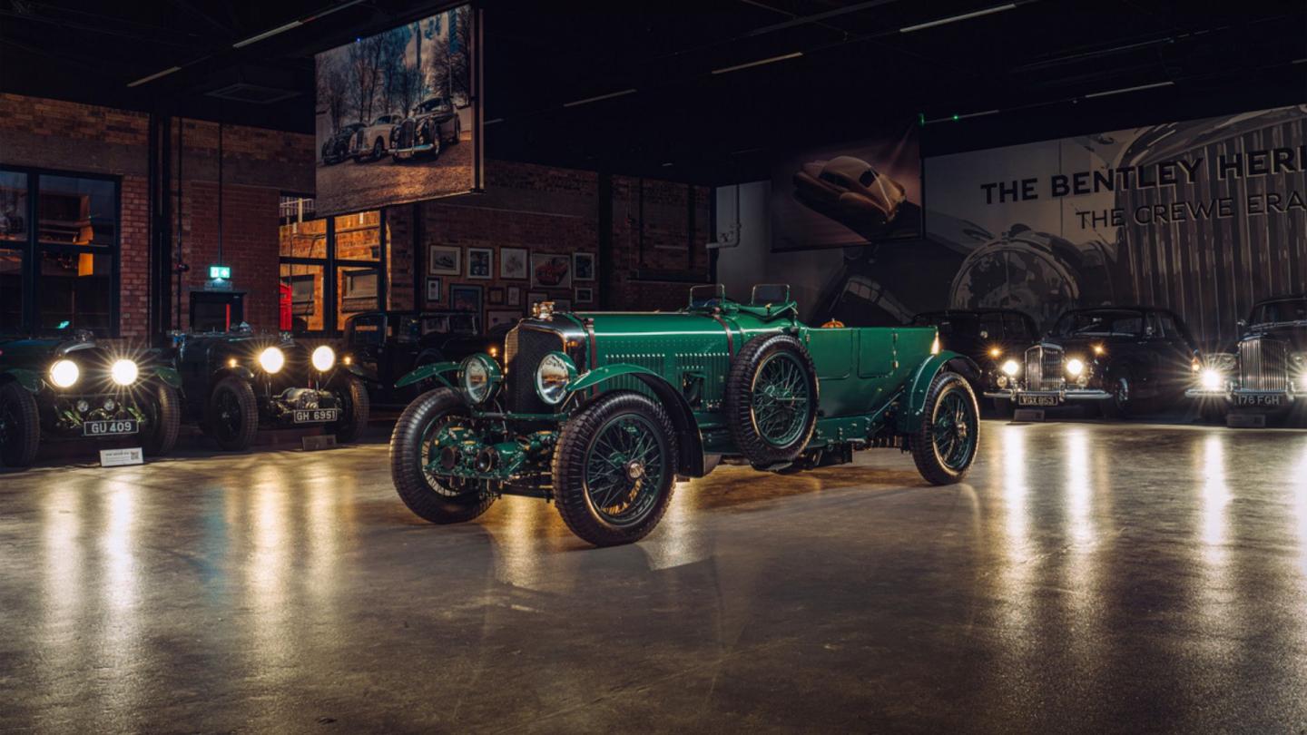 Front three quarter of a green Bentley Speed Six in the Bentley heritage collection garage