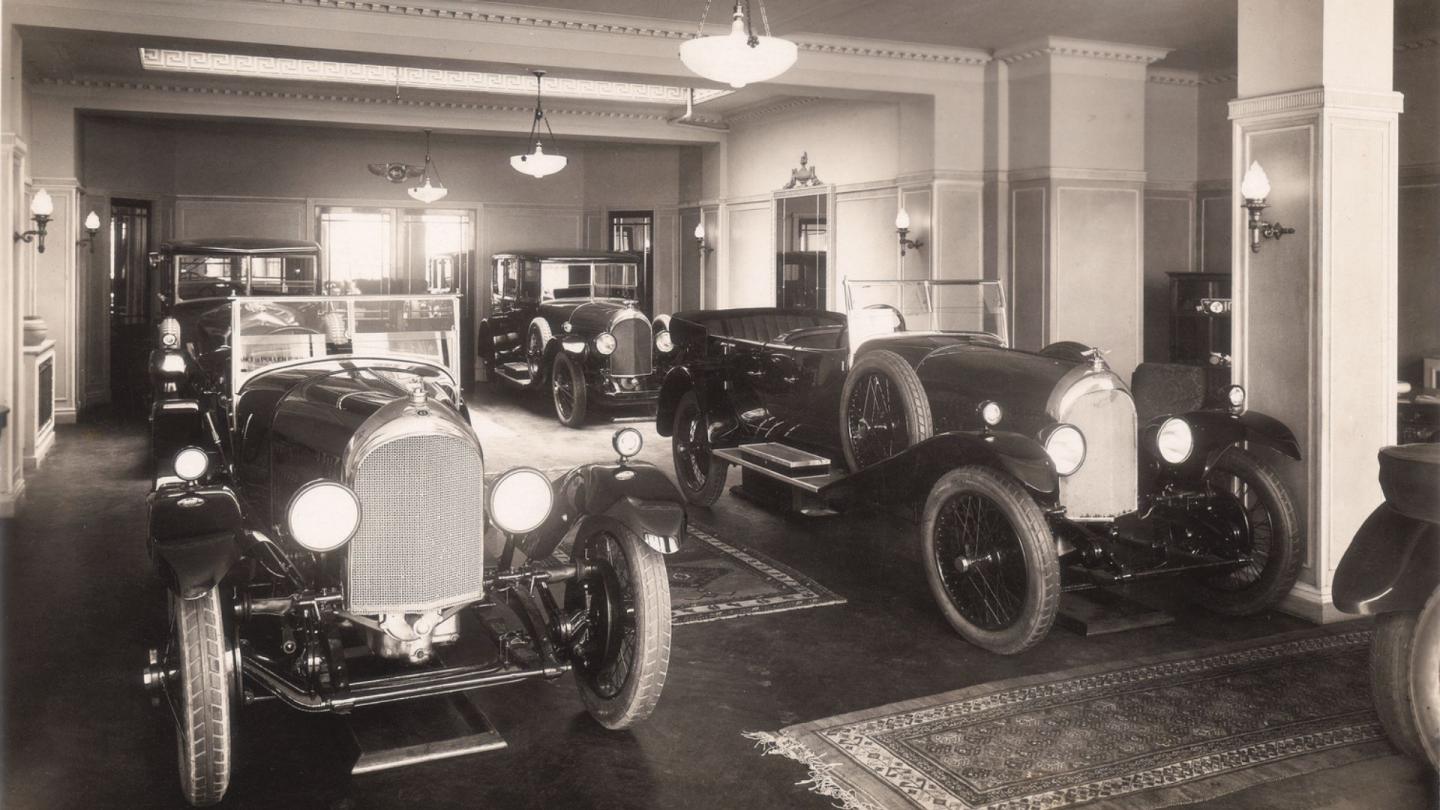 A number of coachbuilt Bentley 6 1/2 Litres in a London showroom ready for sale