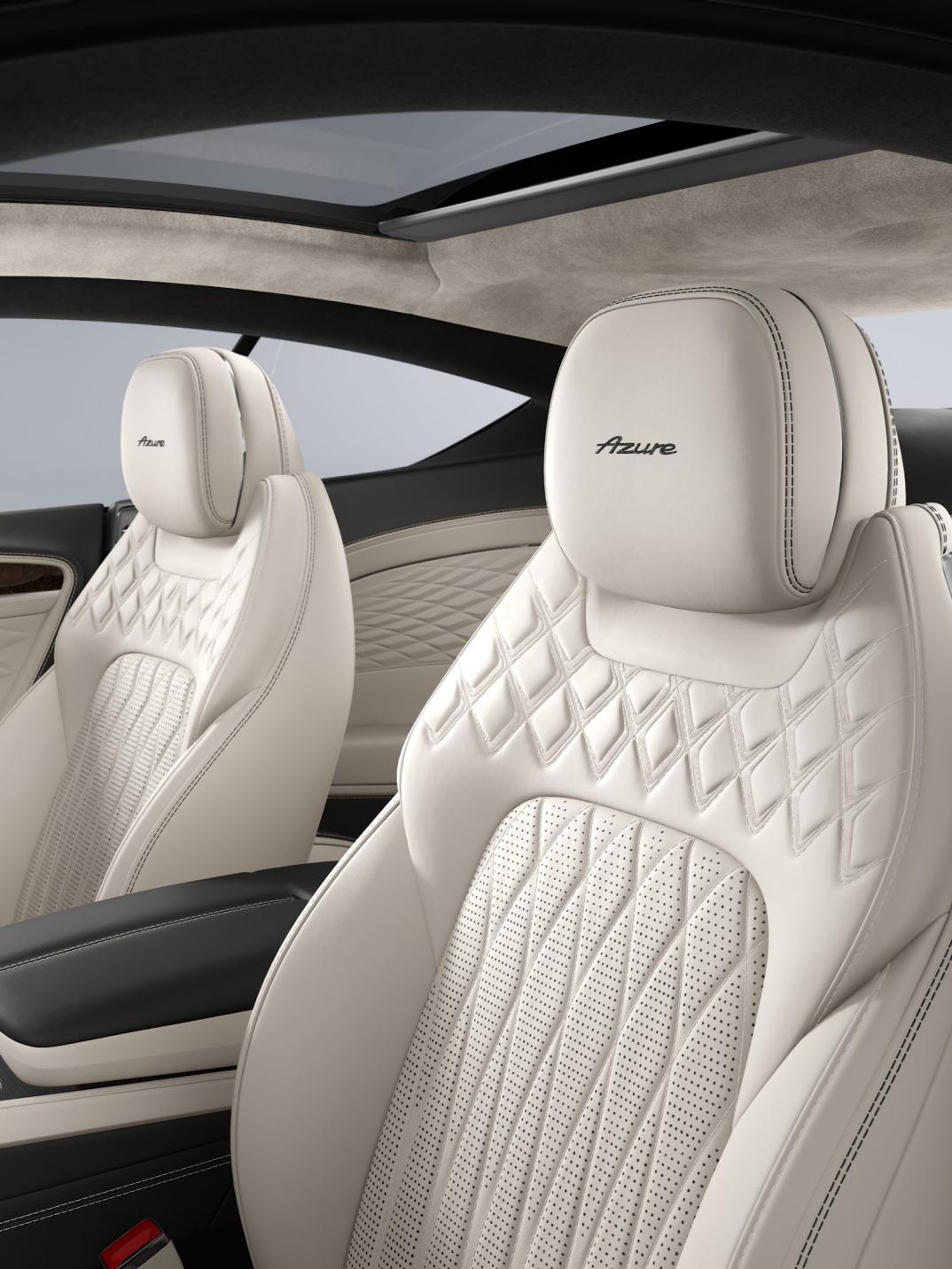Interior view of the Bentley Continental GT Azure featuring seats upholstered in Linen and Cumbrian Green hide.