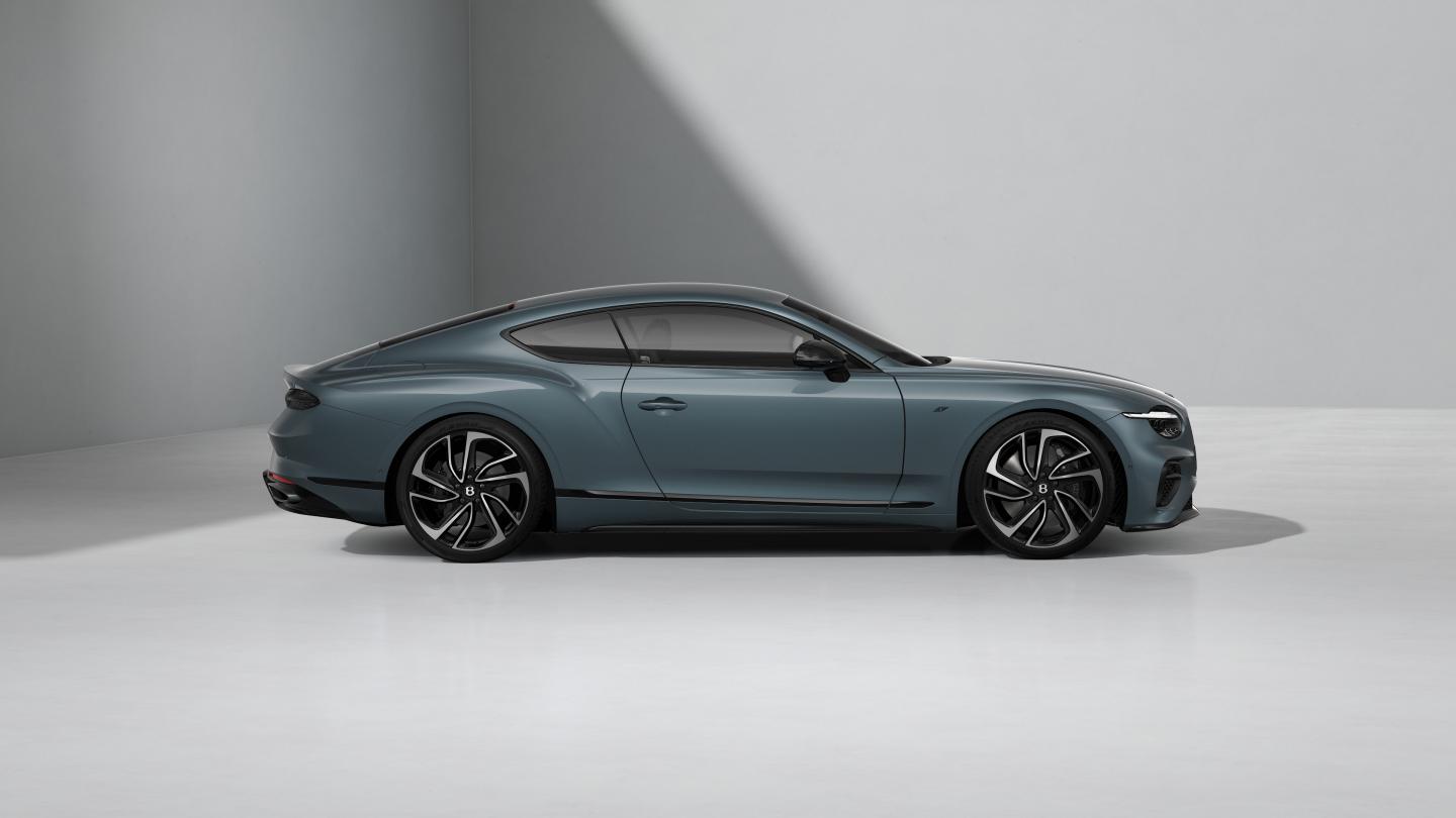 Side profile of the Bentley Continental GT S in Thunder with 22" Ten Swept Spoke Wheel painted Black and Bright Machined.