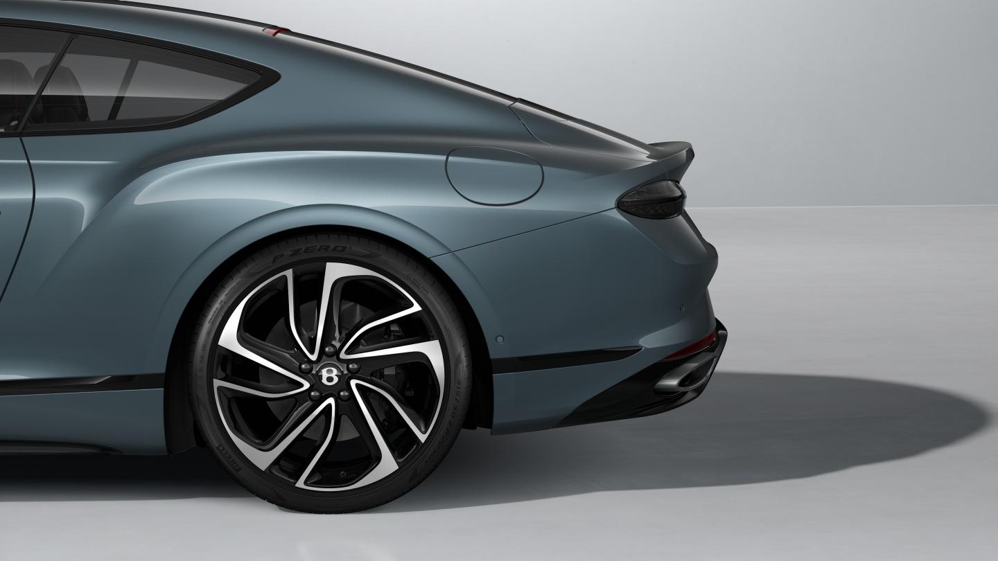 Rear quarter shot of the Bentley Continental GT S in Thunder with 22" Ten Swept Spoke Wheel painted Black and Bright Machined.