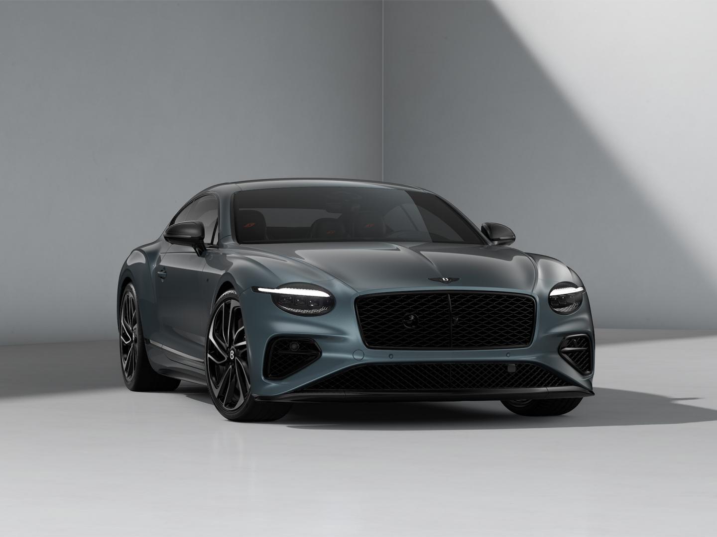 Front three quarter of the new hybrid Bentley Continental GT S with a Thunder Grey exterior colour and Blackline Specification