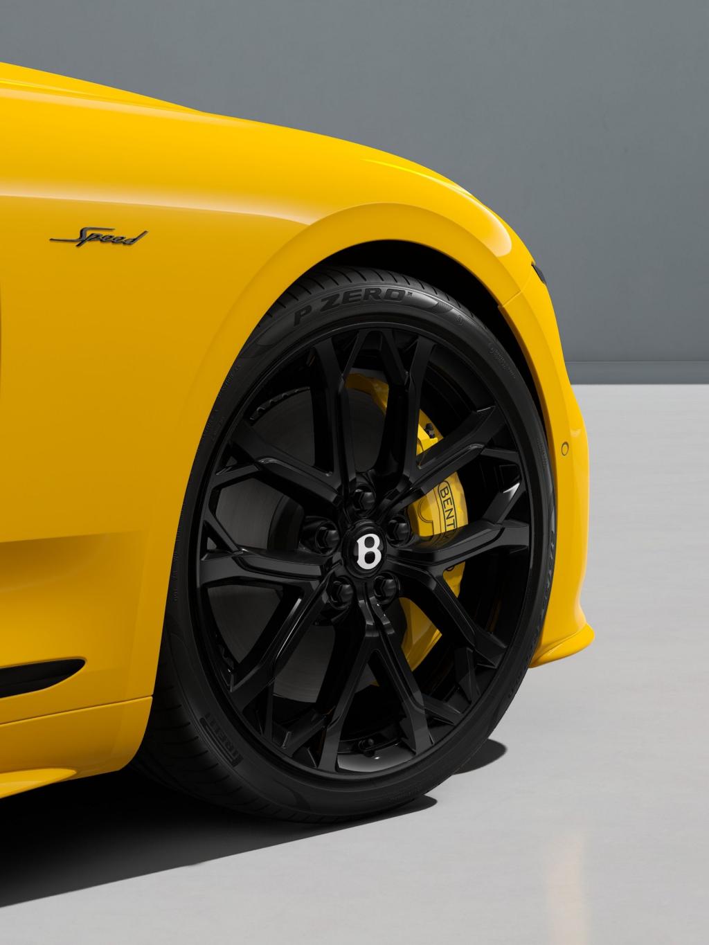 22" Ten Spoke Sports Wheel painted in black with Monaco Yellow brake callipers.