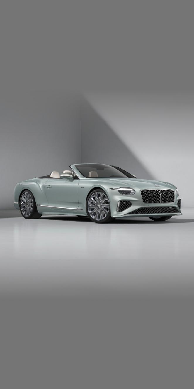 Front three quarters of the Bentley Continental GTC Mulliner in Breeze with a Grey convertible roof.