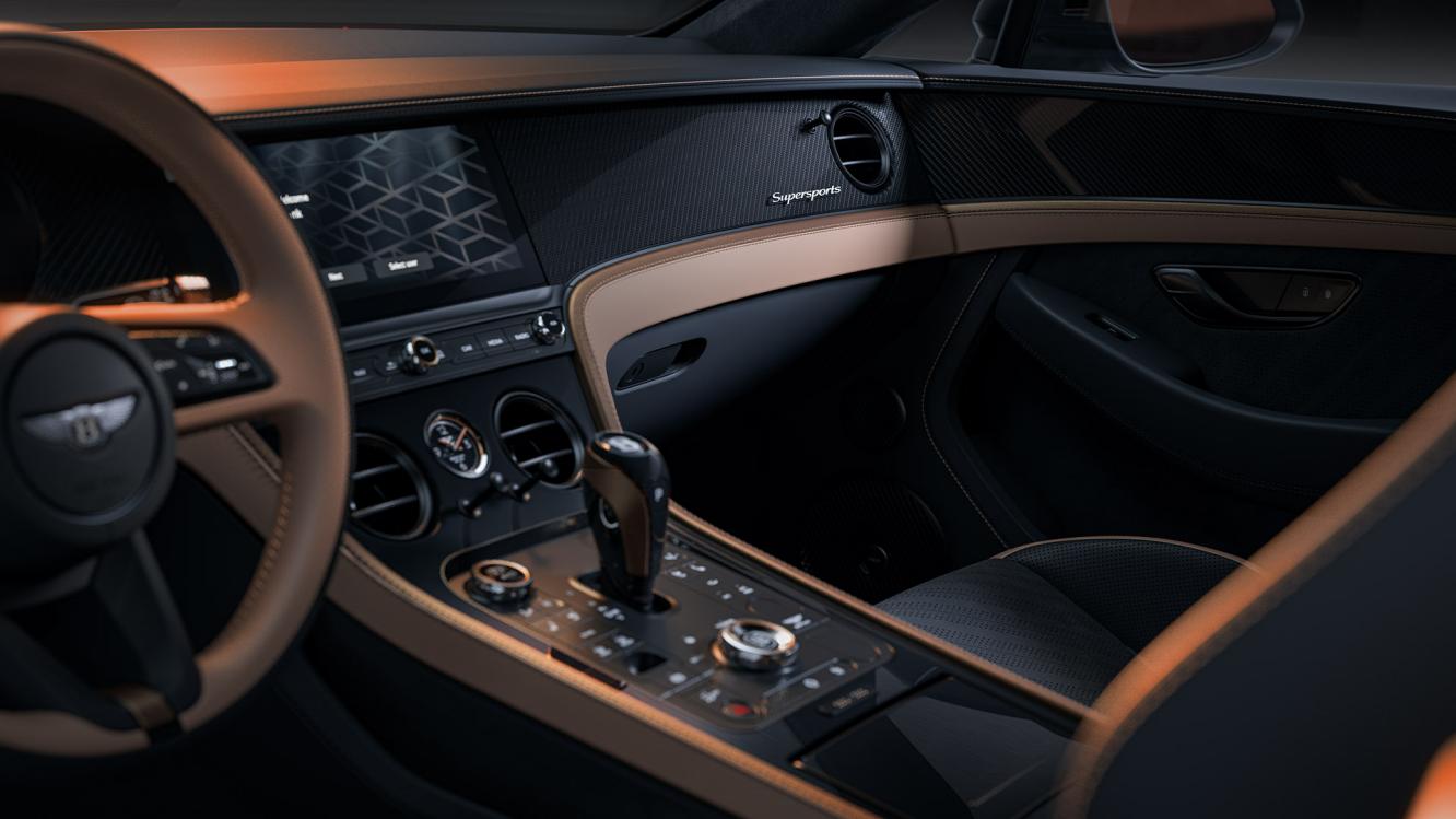 Front cross cabin of the interior of a Bentley Supersports, with a focus on the driver controls available to owners