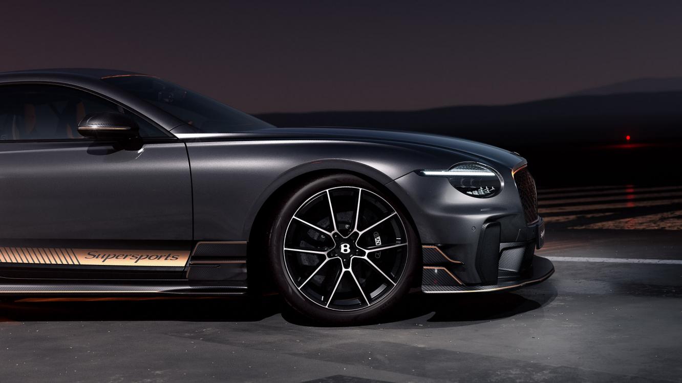 A close up of the wheel and carbon ceramic breaks available on a Bentley Supersports