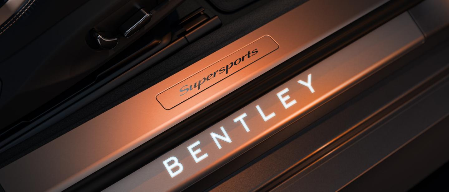 Close up of the Bentley and Supersports plaques available in the door sill of a Bentley Supersports