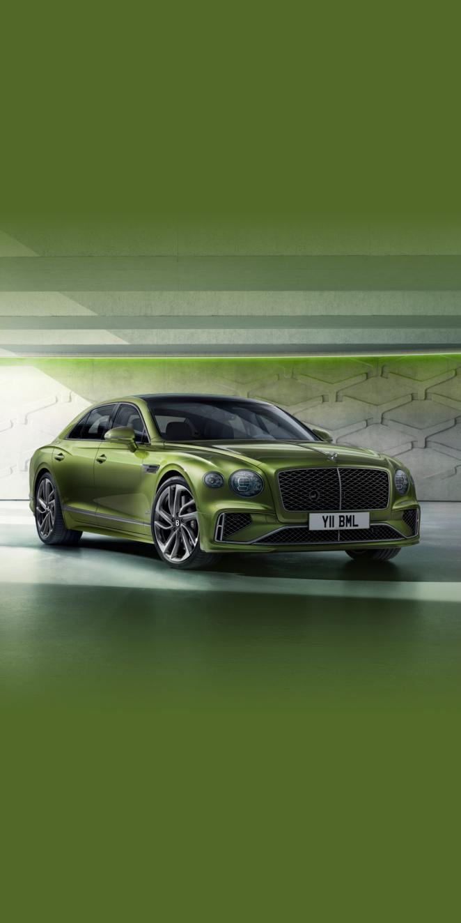 Front side angled view of Bentley Flying Spur Speed Tourmaline Green, featuring 22 inch Speed Wheel- Dark Tint and matrix grille.