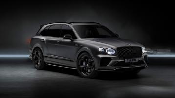 Bentley Bentayga S Black Edition front 3/4 featuring 22 inch S directional wheel - Black Painted and Polished as well as Ice White accents on the styling kit