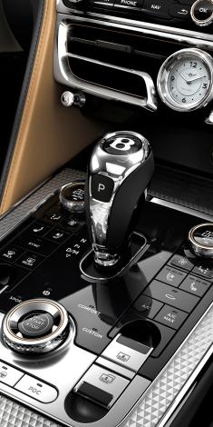Grand Black with Diamond Milled Console of Bentley Flying Spur Mulliner with 8 speed auto transmission lever in view.