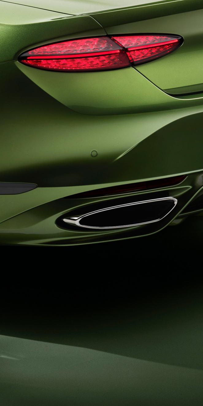 Close up of the exhaust of the new Bentley Continental GTC Speed in Tourmaline Green