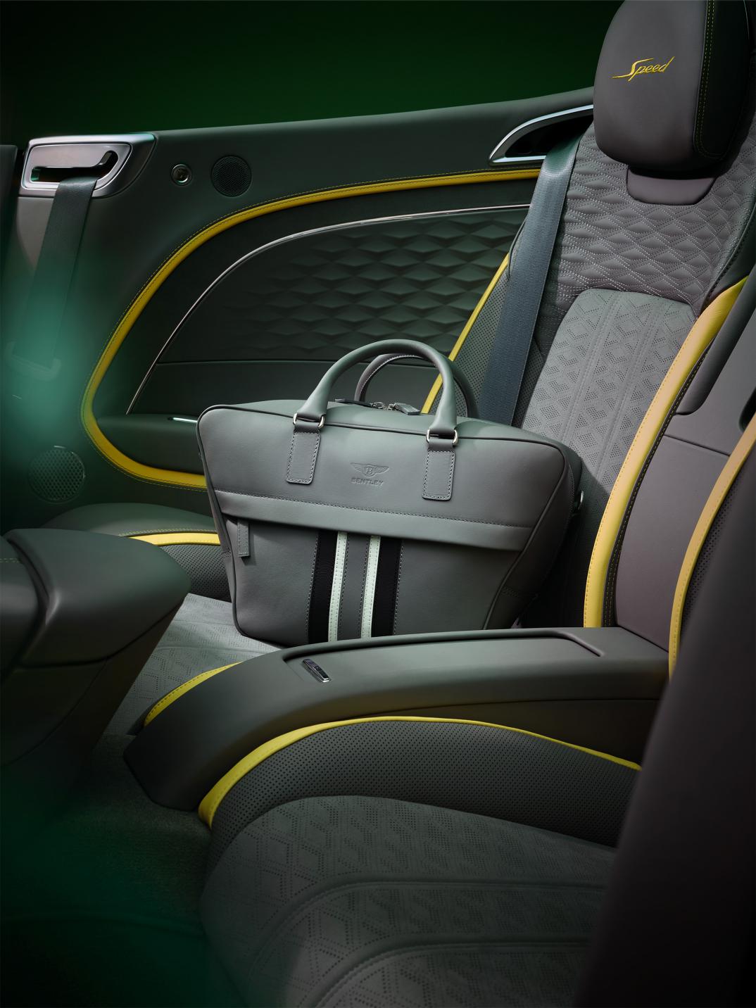 The new leather luggage set on the rear seat of the new Bentley Continental GTC Speed with Gravity Grey main hide and Hyper Yellow secondary hide