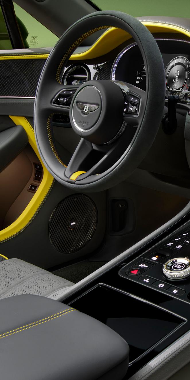 Close up of the steering wheel and Naim audio system available in the new Bentley Continental GTC Speed