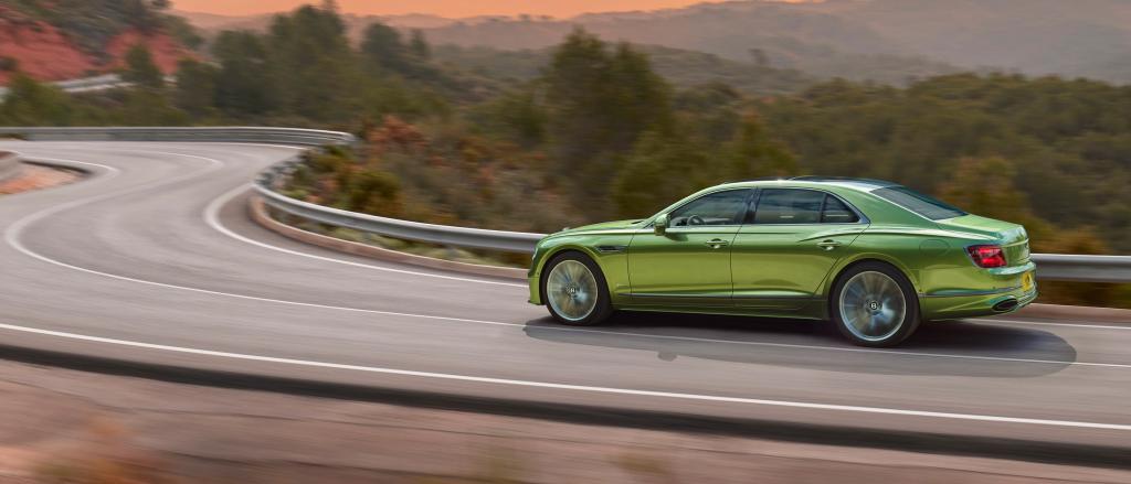 The New Bentley Flying Spur Speed in Tourmaline Green driving in the mountains