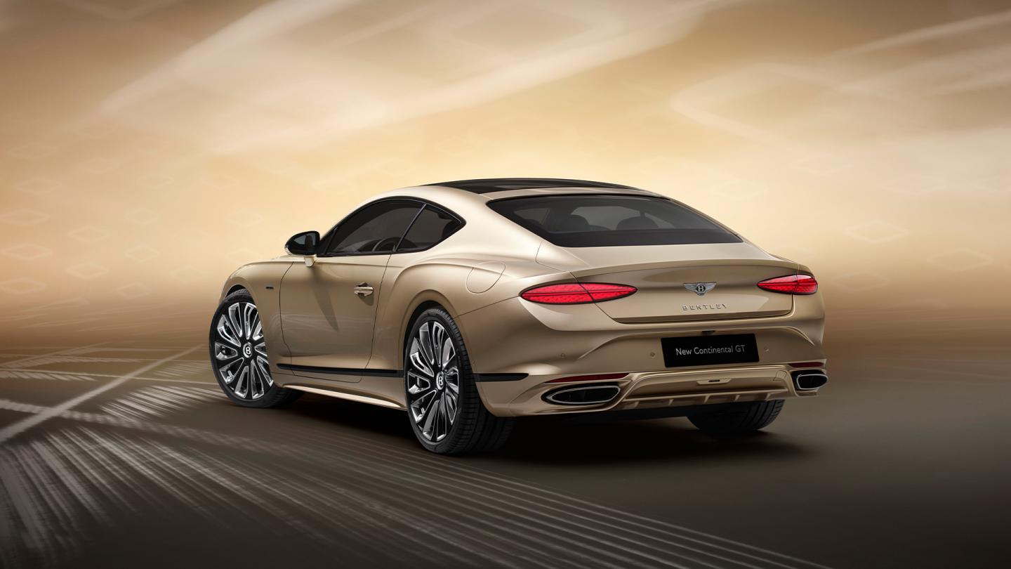 Rear three quarter of the new hybrid Bentley Continental GT Mulliner with a Patina exterior colour and exclusive Mulliner 22" directional wheels