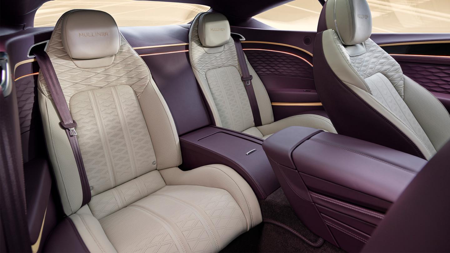The rear cabin of the new hybrid Bentley Continental GT Mulliner with a exclusive Mulliner colour split with Linen main hide and Damson secondary hide