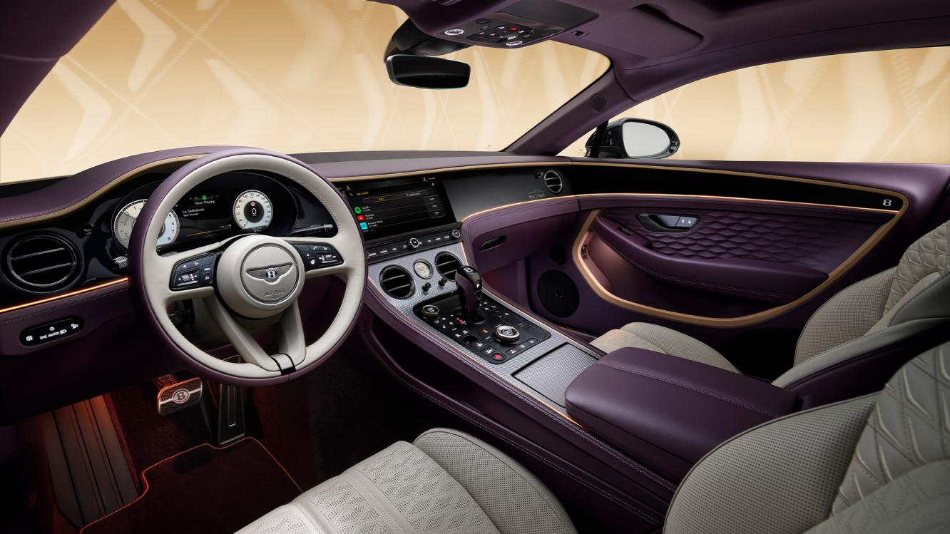 The front cabin of the new hybrid Bentley Continental GT Mulliner with a exclusive Mulliner colour split with Linen main hide and Damson secondary hide