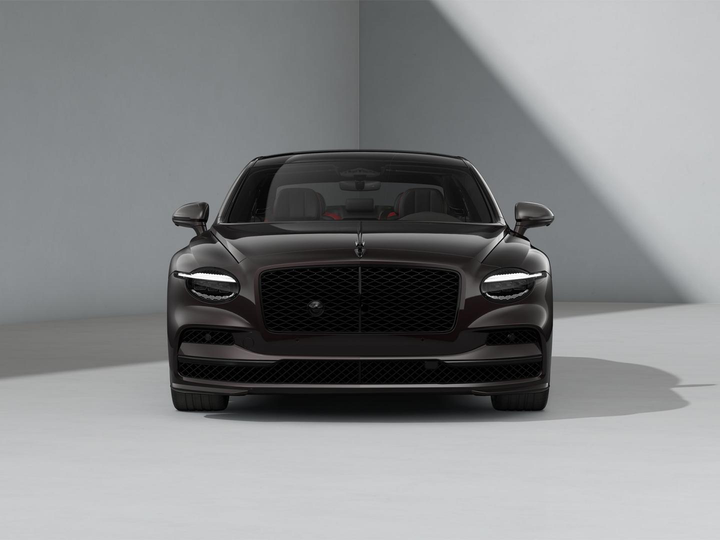 Front-on shot of the Bentley Flying Spur Speed in Black Velvet with Blackline Specification and dark exterior detailing.