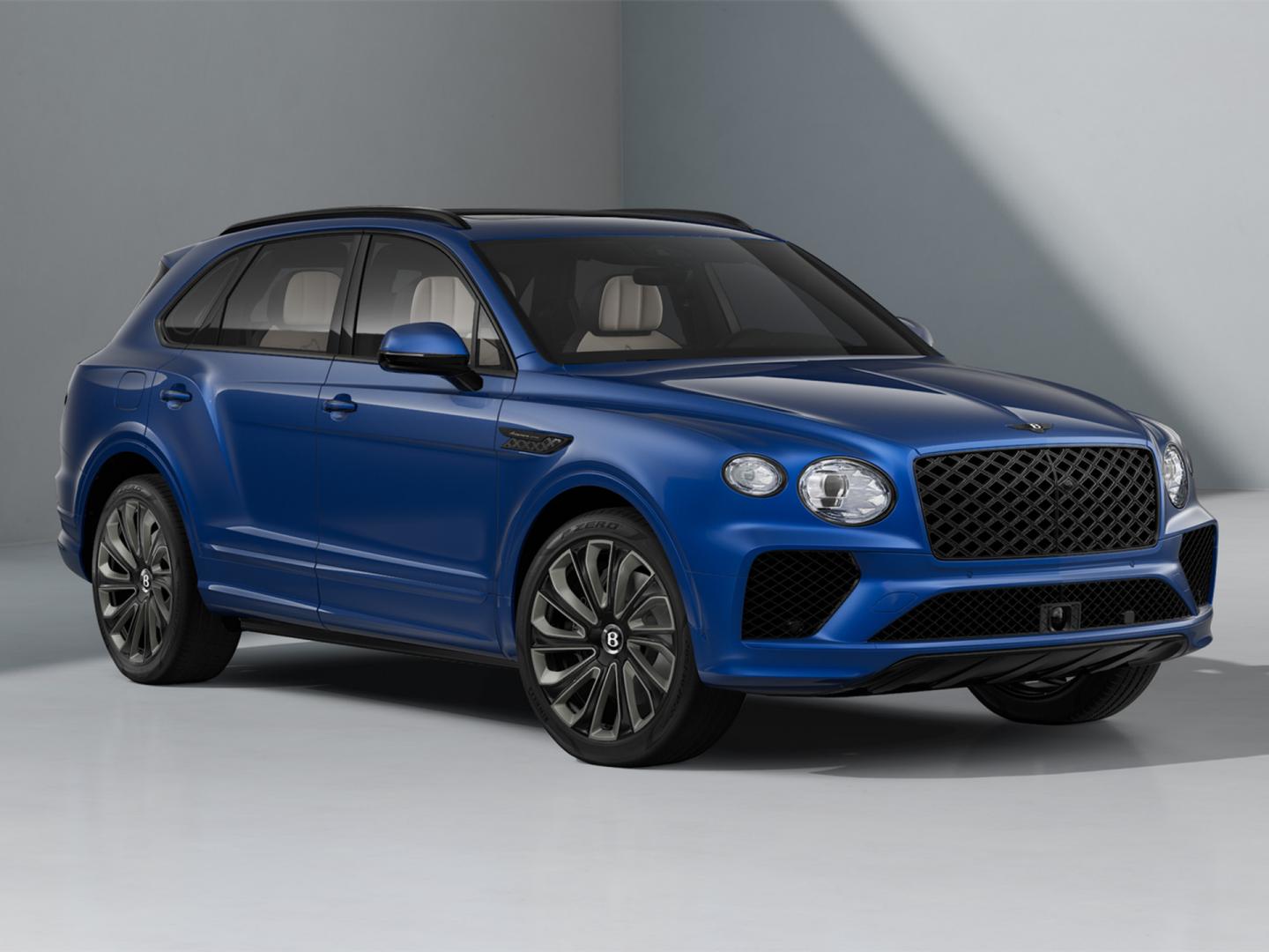 Bentley Bentayga Artenara Edition SUV in Sequin Blue paint and 22” Mulliner Gloss Black wheels front 3/4