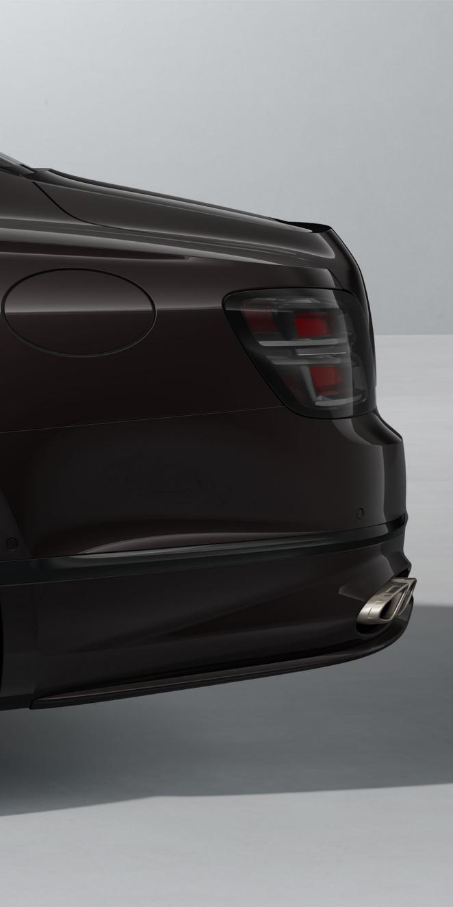 Side view of the rear of the Bentley Flying Spur Speed in Black Velvet with Blackline Specification and dark exterior detailing.