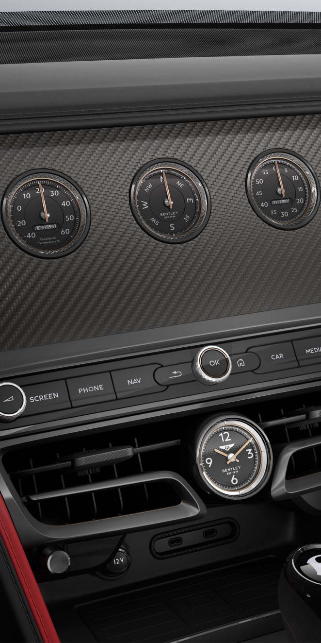 Interior shot of the Bentley Flying Spur Speed rotating display with Piano Black Console and High Gloss Carbon Fibre veneer.