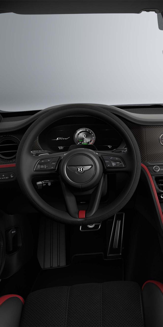 Driver’s view of the Bentley Flying Spur Speed steering wheel with Hotspur and Beluga interior trim.