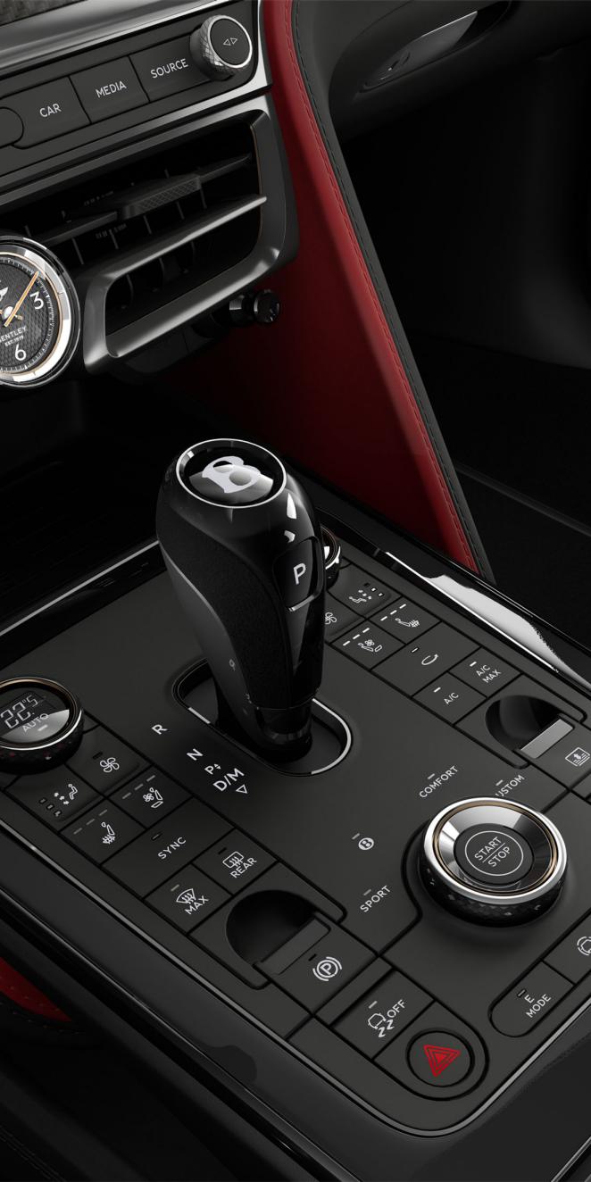 Close up of the Piano Black console, including driver controls in the Bentley Flying Spur Speed.