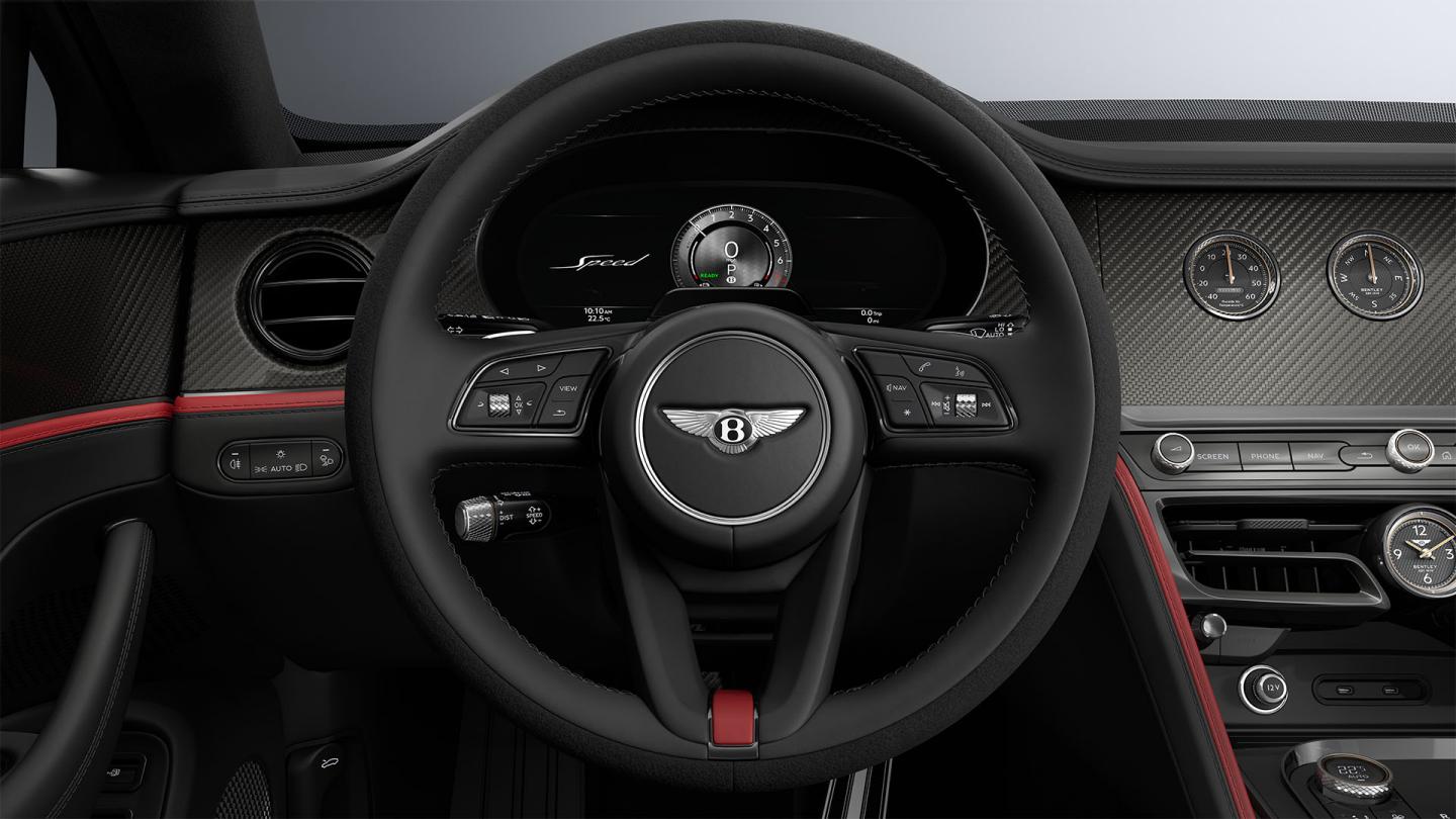 Driver’s view of the Bentley Flying Spur Speed steering wheel with Hotspur and Beluga interior trim.